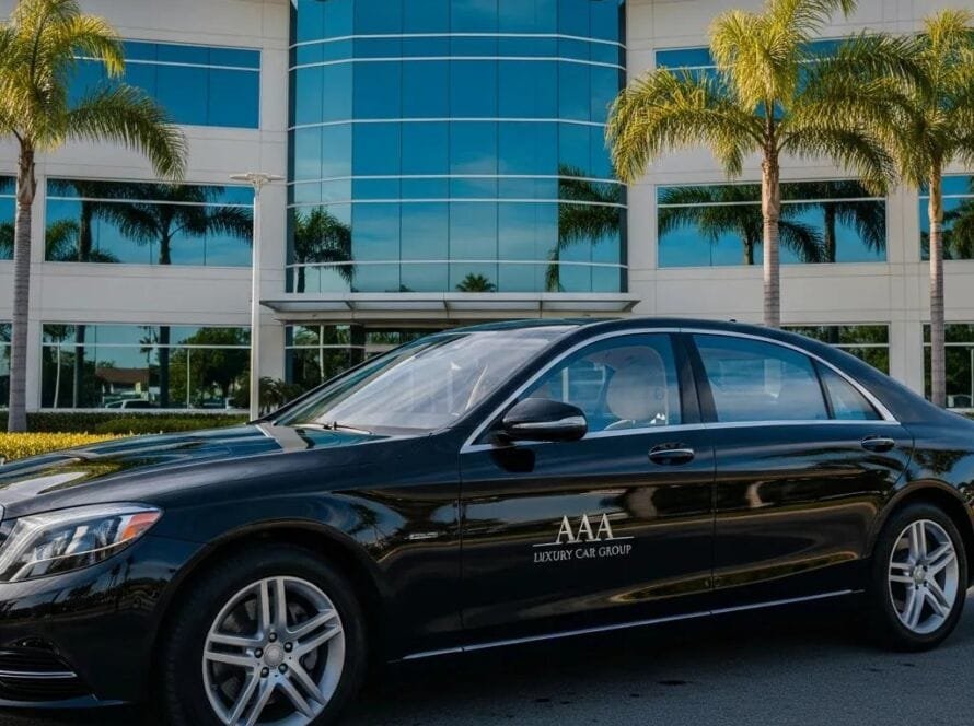 Luxury black sedan in front of a modern office building in Orange County, representing premium car service for business travelers