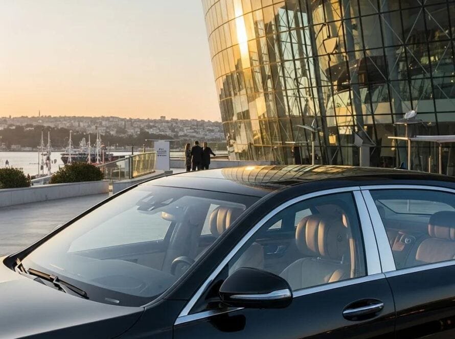 Luxury vehicle in an elegant setting, representing high-end travel options